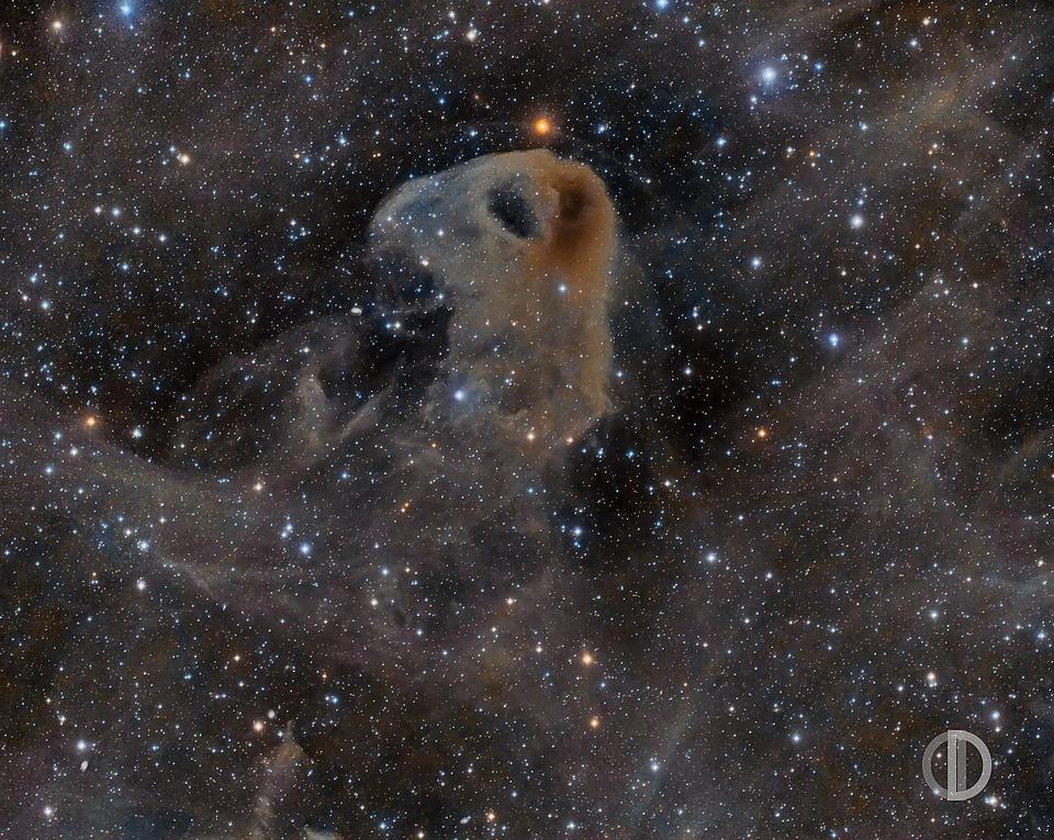 The Baby Eagle Nebula, LBN 777, appears to be a grey, dusty region in space.