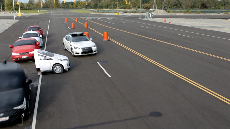 A Toyota test vehicle using Guardian swerves to avoid a potential crash at the company's Michigan test facility.