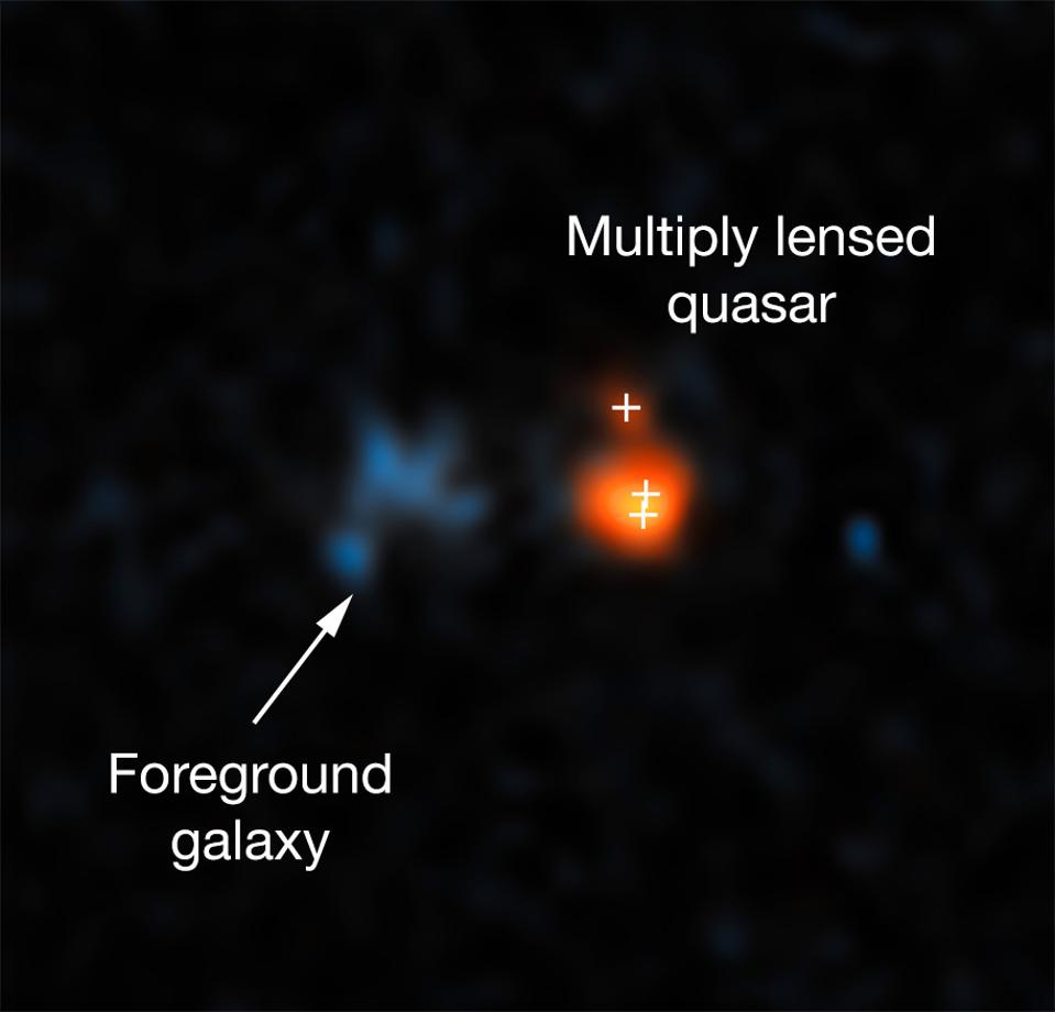 This image shows the distant quasar J043947.08+163415.7 as observed with Hubble.