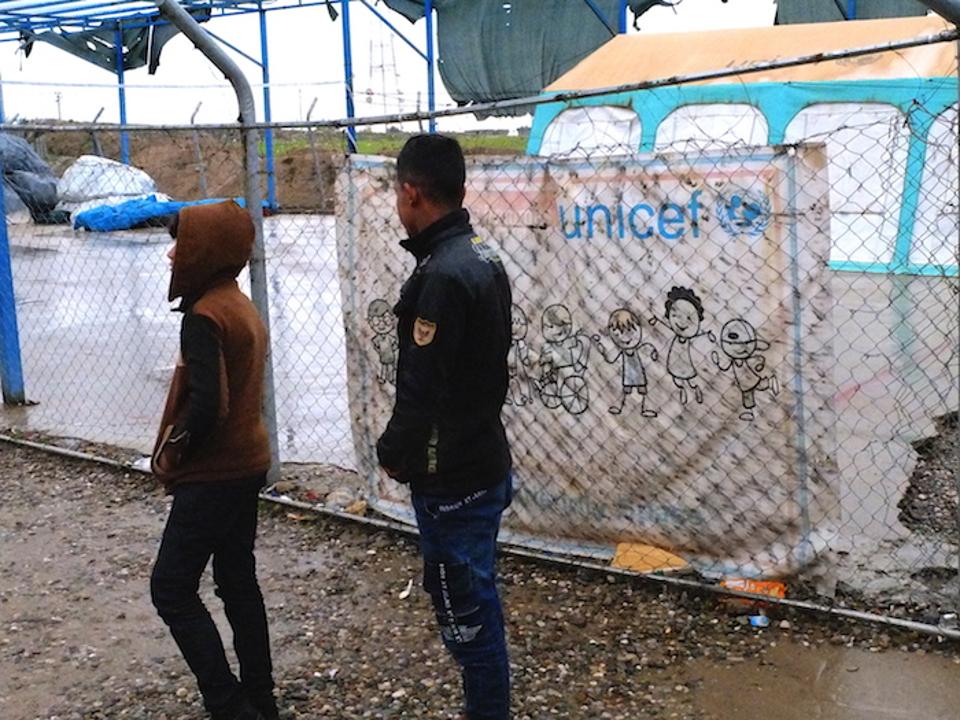 Aziz, 11, and Mahmoud, 17 (names changed), in front of their tent in Debaga camp in Iraq's Erbil Governate.