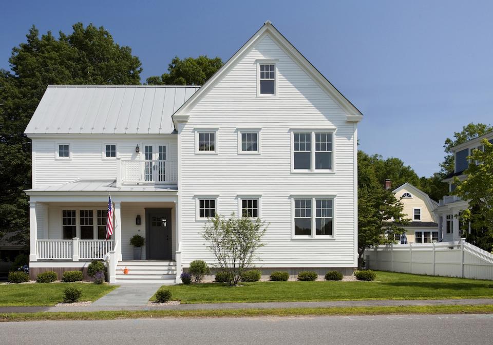 A New England Farmhouse with a standing seam roof.