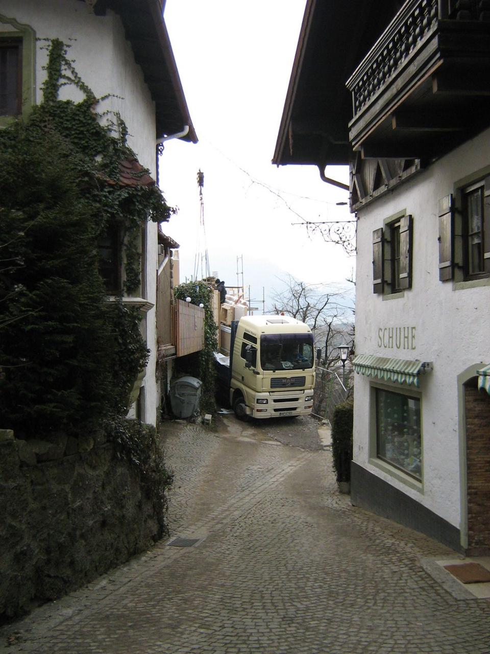 The flatbed truck had to carefully navigate the narrow roads up to the site where the house would be built.