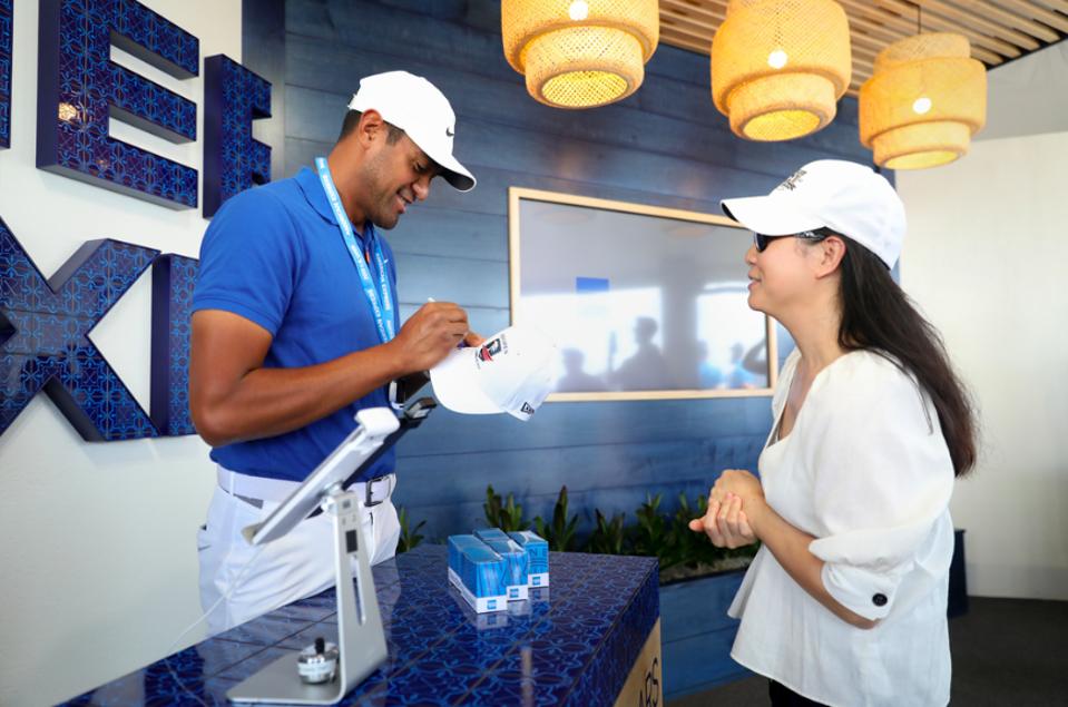 Tony Finau (left) surprises fans at Fan Services Hosted By American Express at the U.S. Open at Pebble Beach Golf Links on June 10, 2019 in Pebble Beach, California