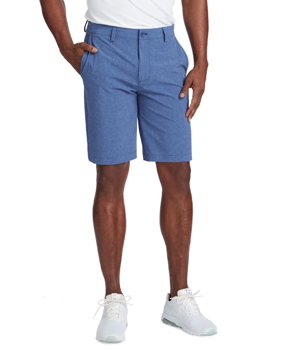 Man from waist down wearing shorts and sneakers