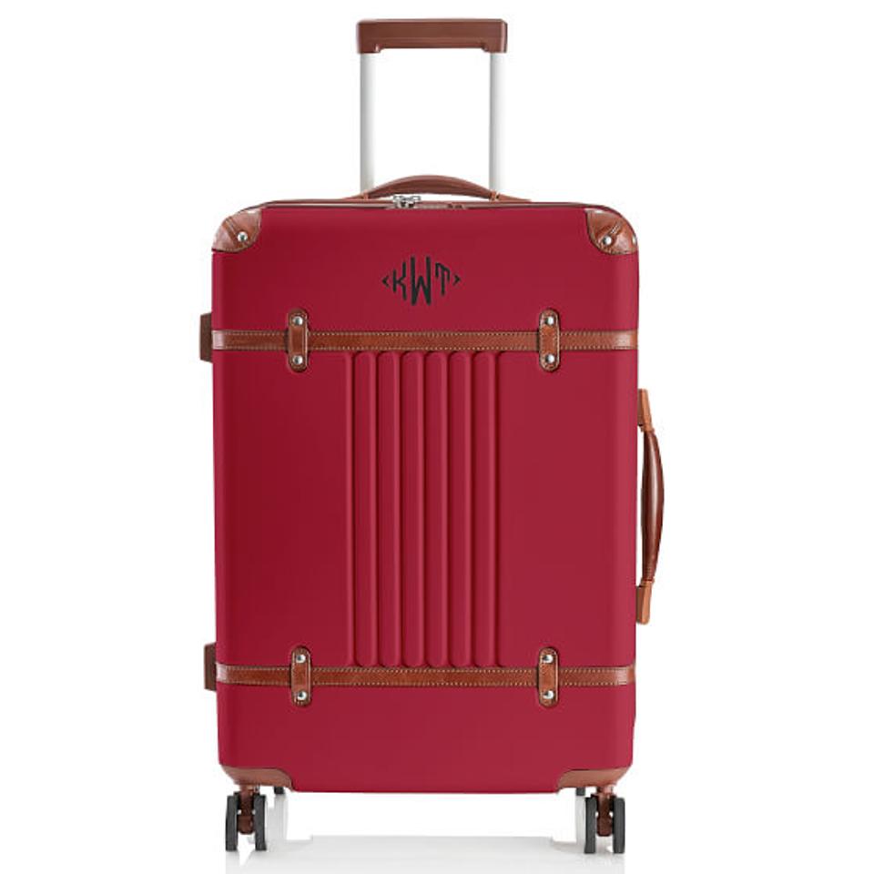 Red suitcase with leather detail