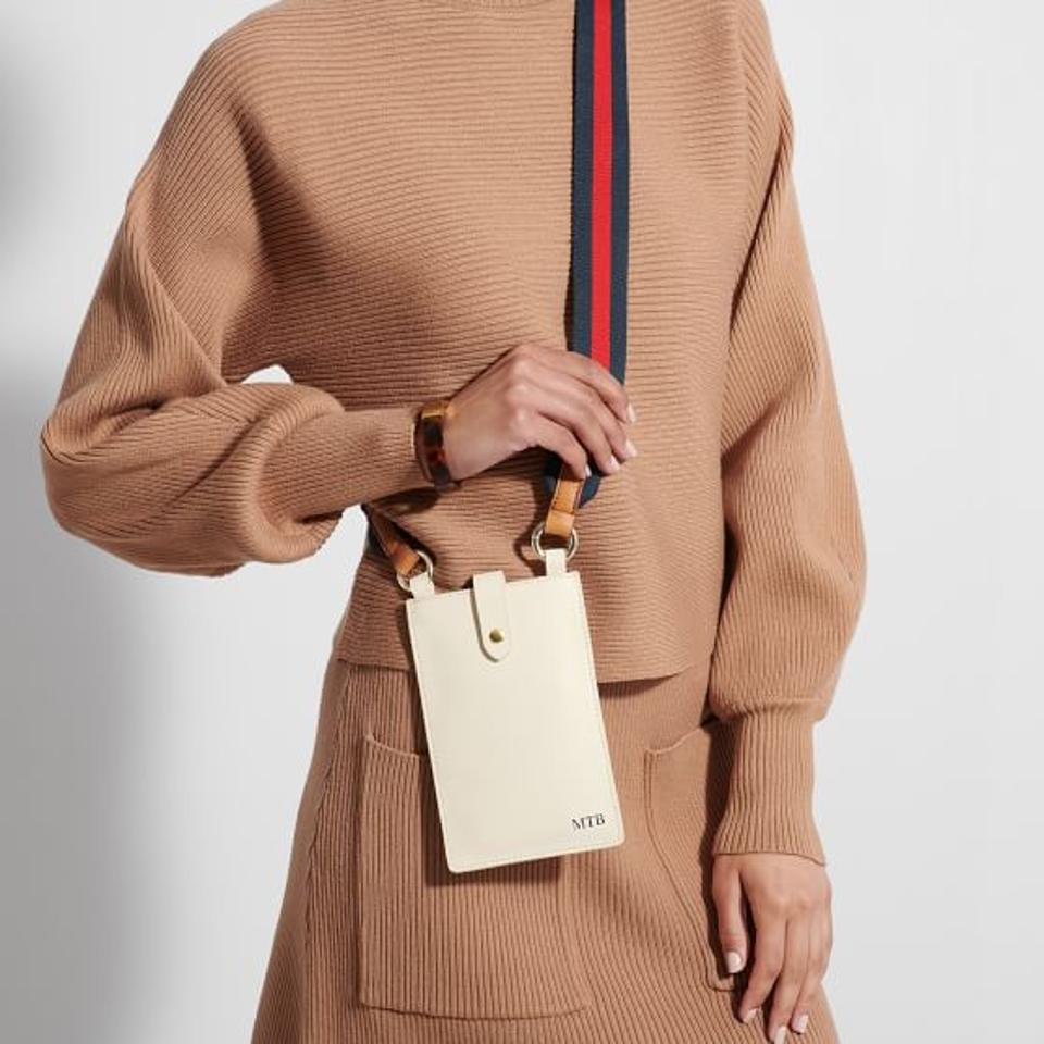 Woman with a small crossbody bag to fit a phone
