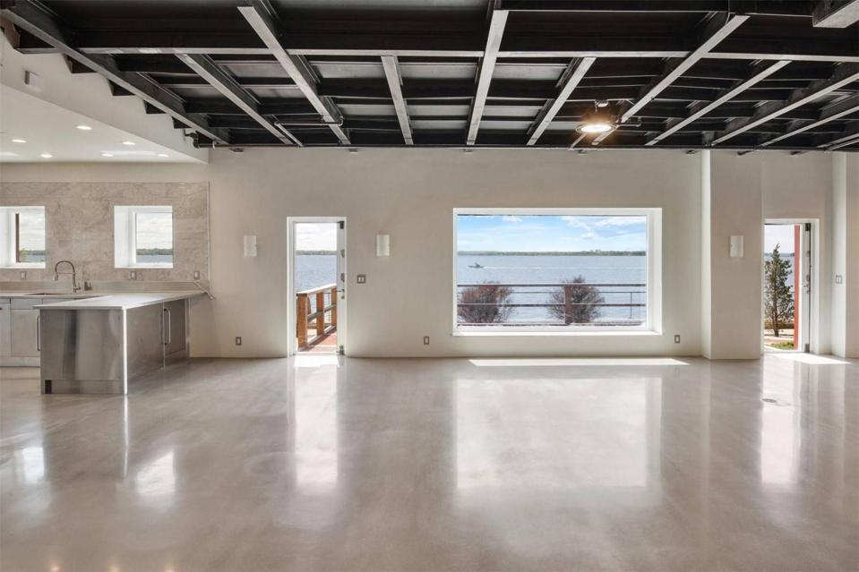 An open kitchen overlooking water.