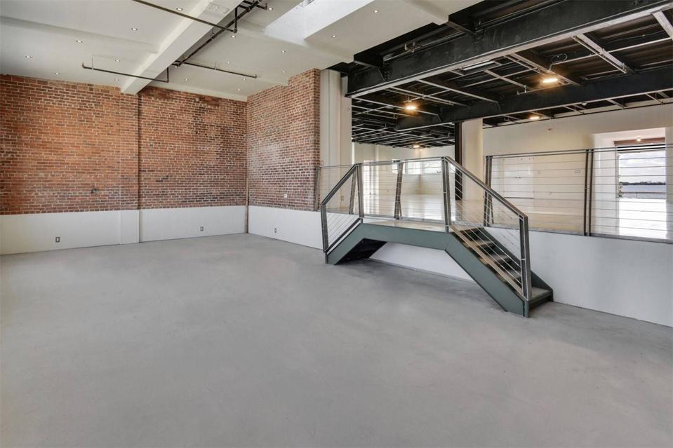 A large room with exposed brick walls.