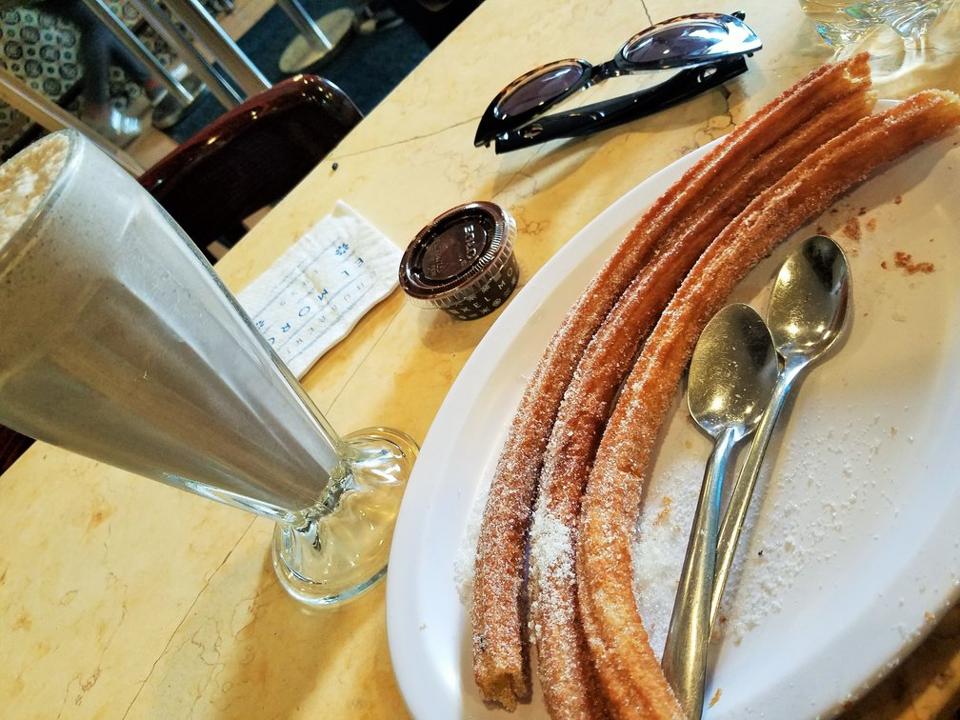 Churros, milkshake and chocolate dipping sauce.