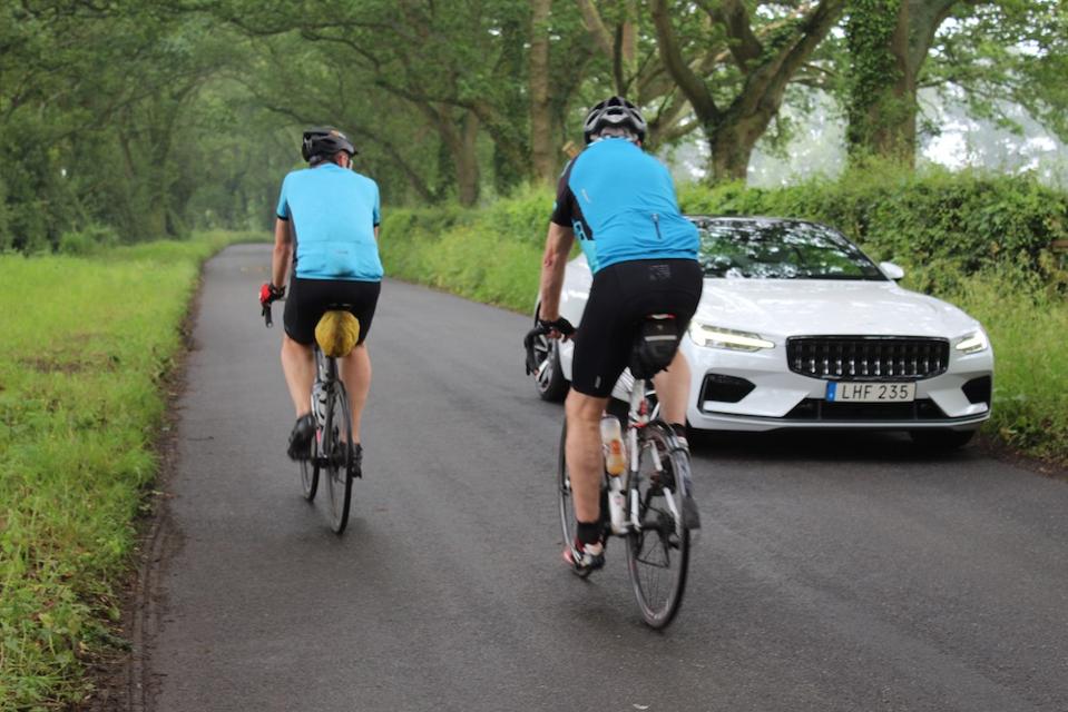 I drive on regular English country lanes largely unnoticed, bar these cyclists who are intrigued by the Polestar 1