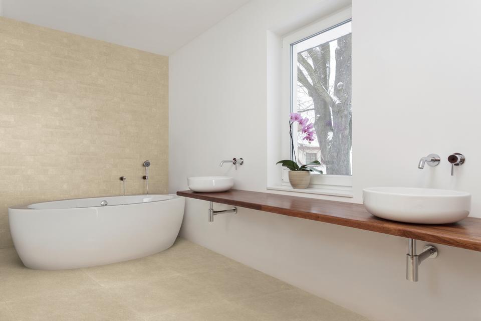 The porcelain stone in this bathroom emulates ancient stone.