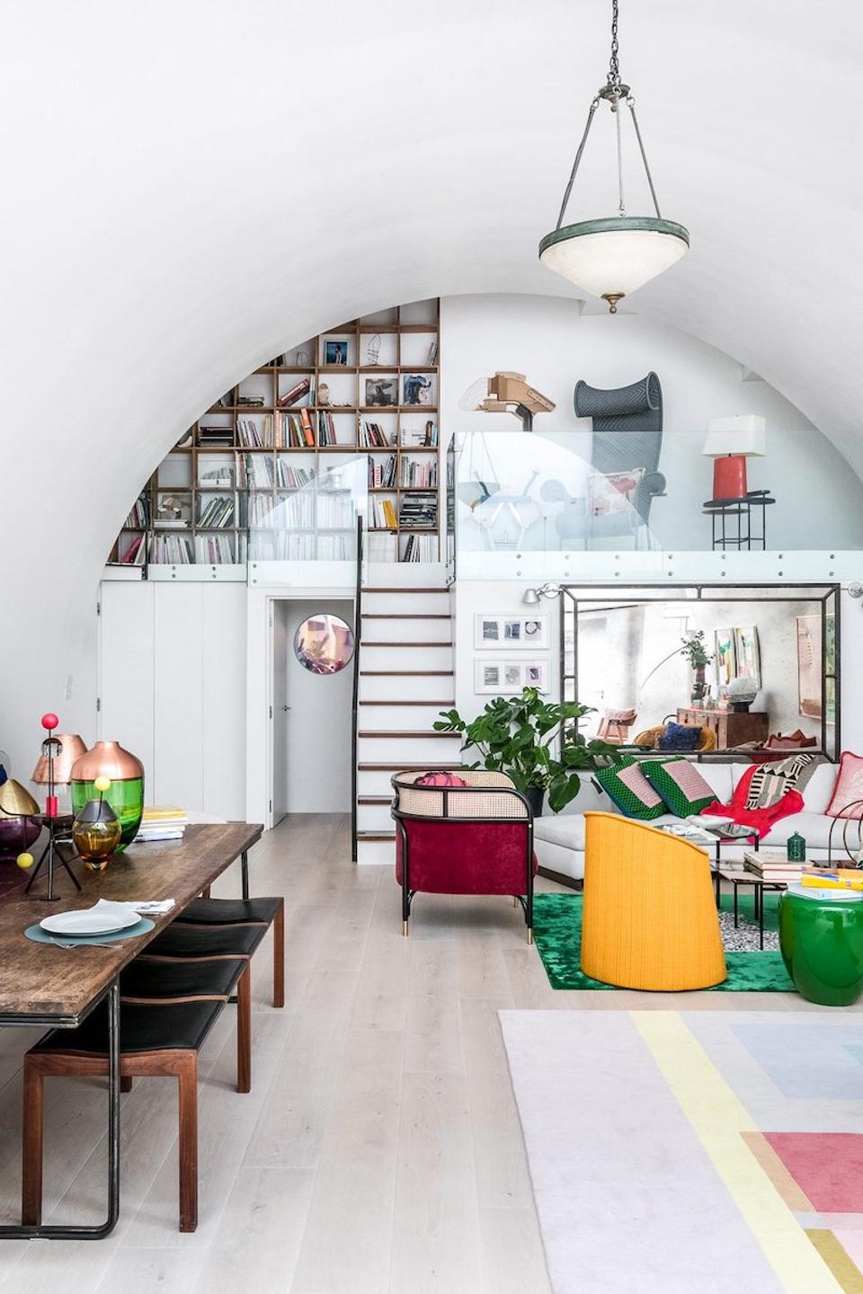 Steps lead up to the balcony where there is a sitting area, bedrooms and a bathroom.