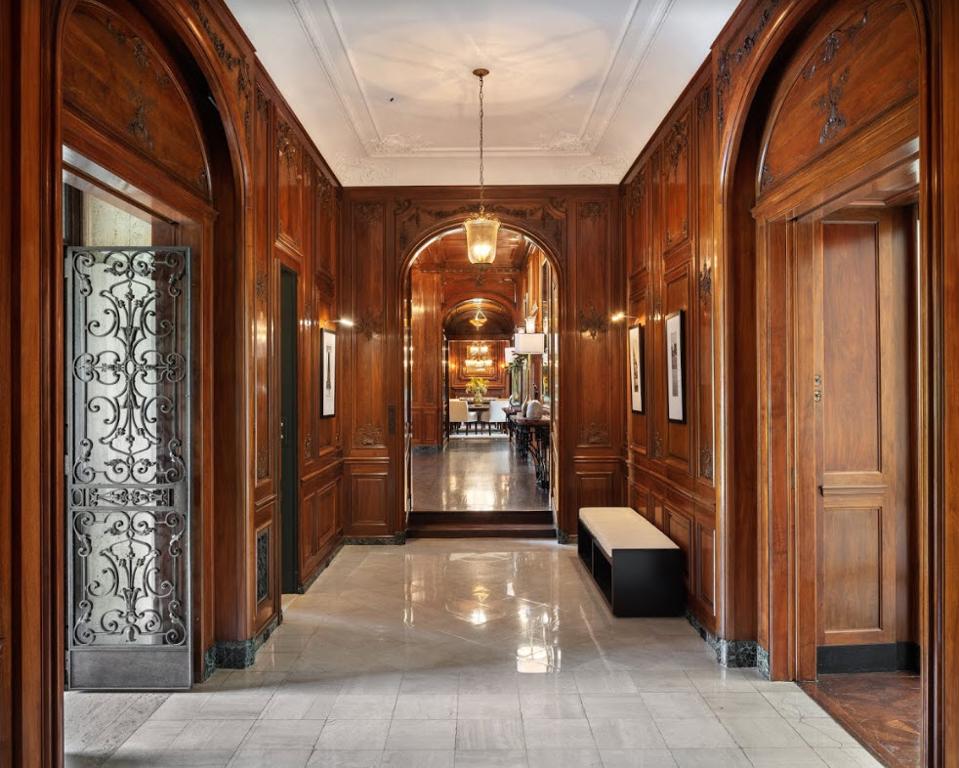The Italian Renaissance-style home incorporates classic European design with grand proportions and intricate moldings.