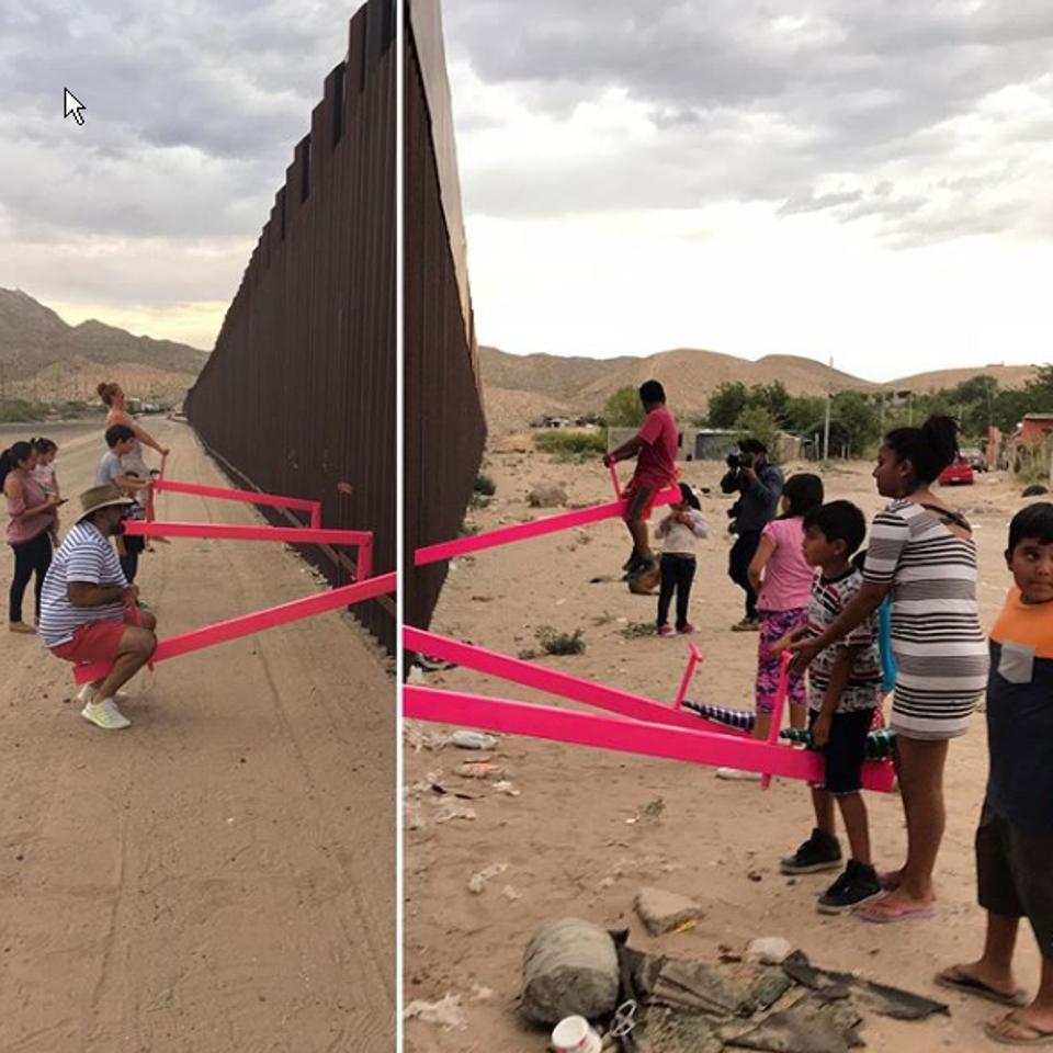 Ronald Rael and Virginia San Fratello installed hot pink seesaw at the Us-Mexico border on Saturday.