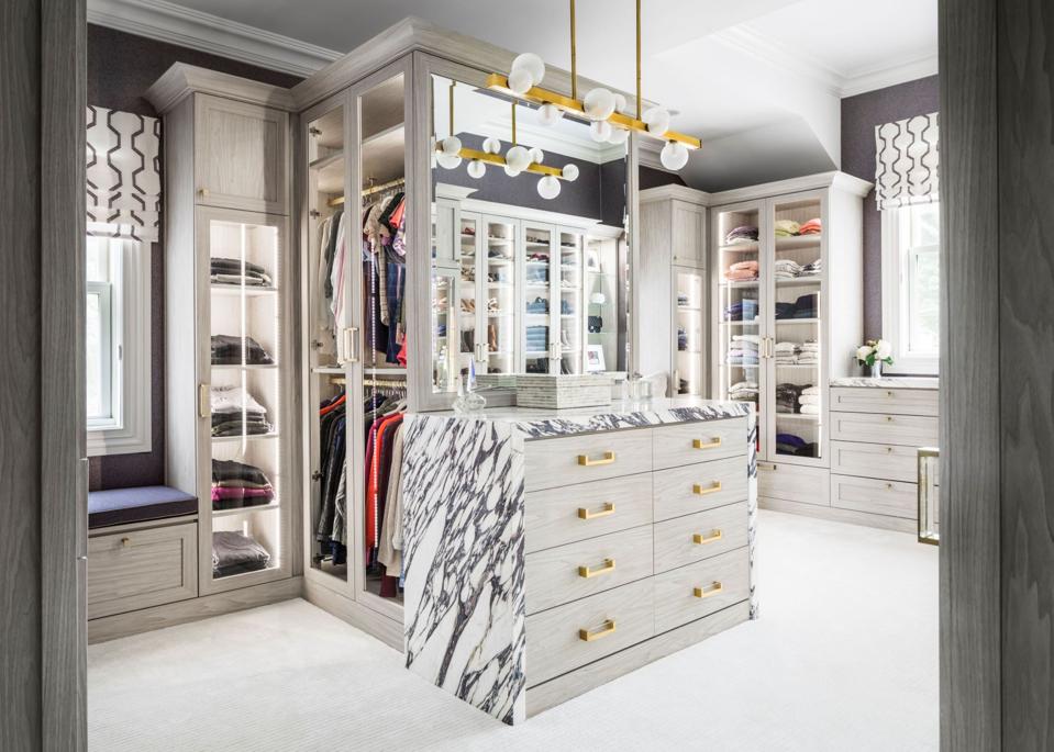 Luxury closet with lighting and cabinetry