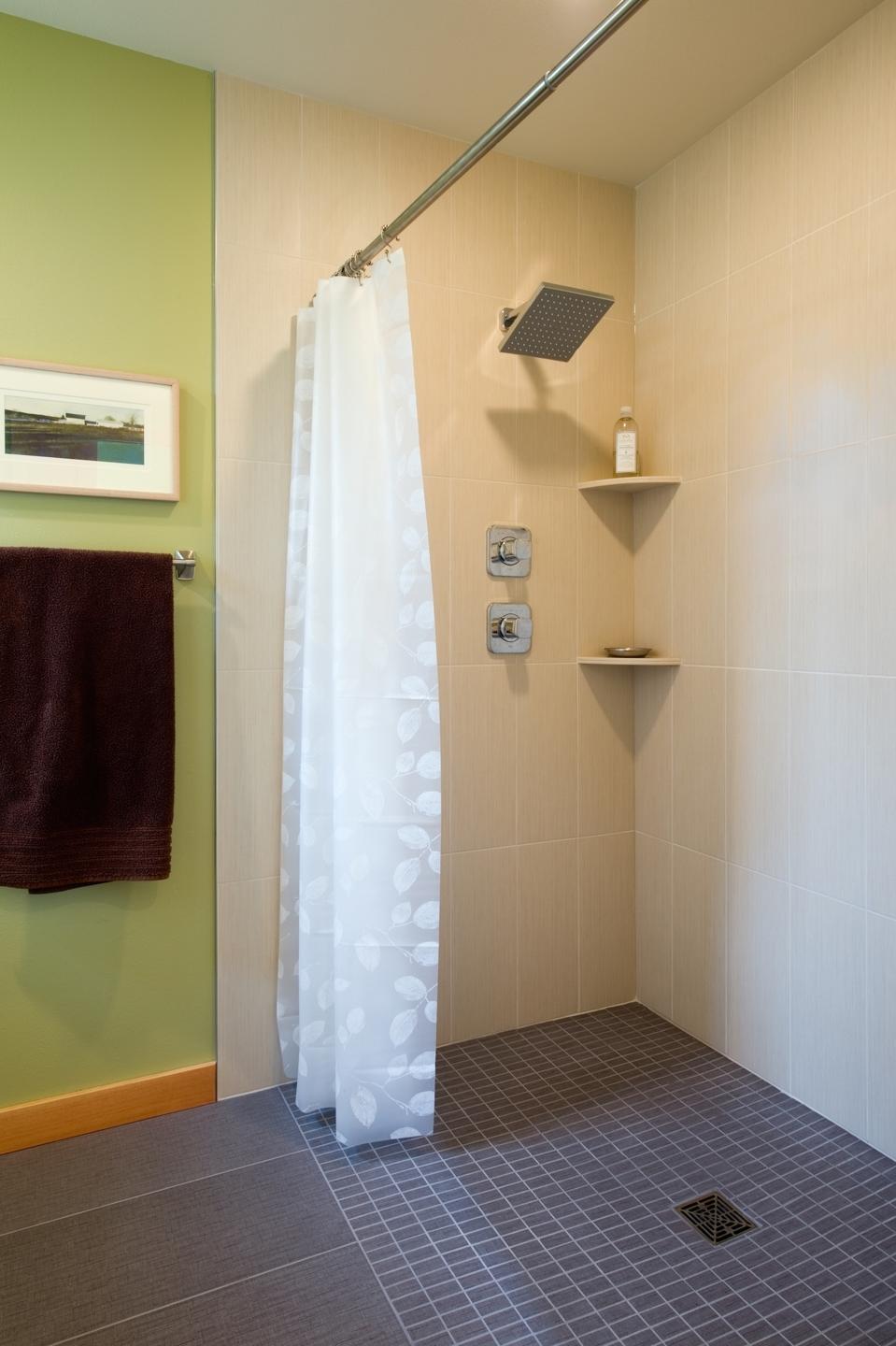 Borderless showers are becoming increasingly popular. This one is in a home on Whidbey Island and was designed and built by FabCab with prefabricated timber frame and SIPs
