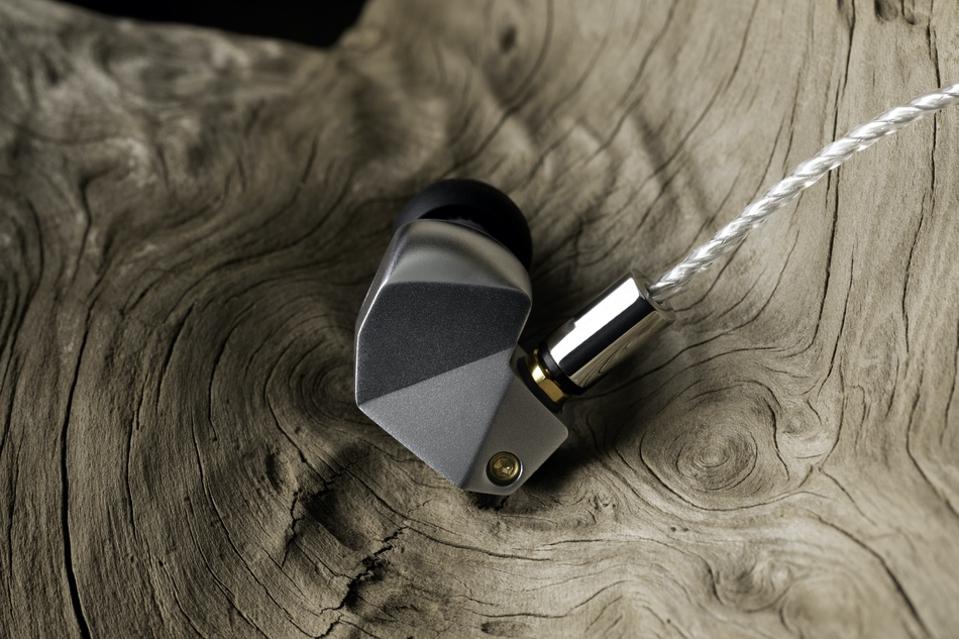 Final B3 earpiece on a tree stump