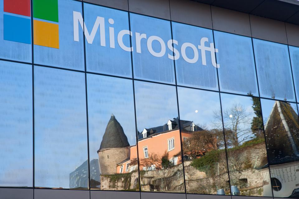A reflection of mediaeval castle in windows of Microsoft's office