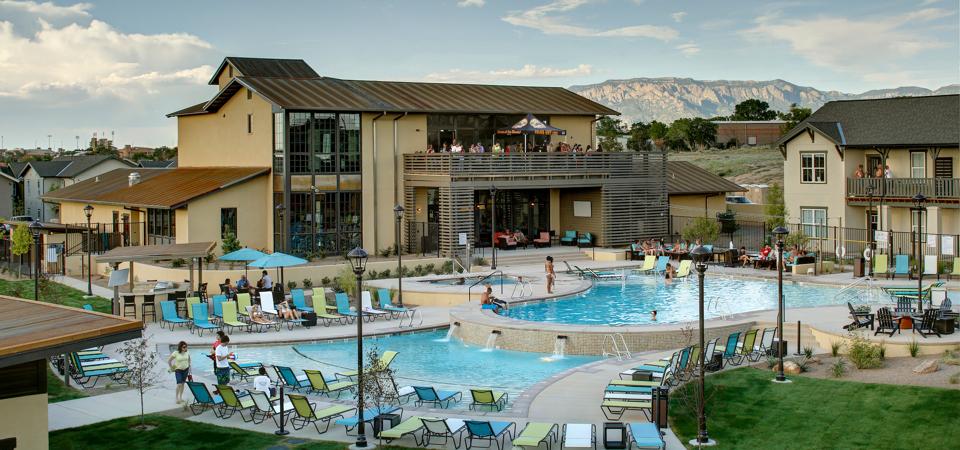 View of club house with swimming pool at the University of Albuquerque