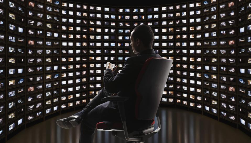 Man watching video on monitors