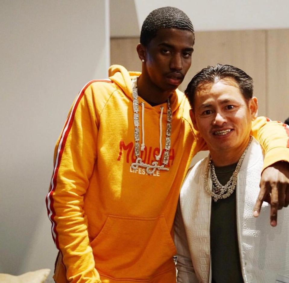 Diddy's son, King Combs standing with Johnny Dang