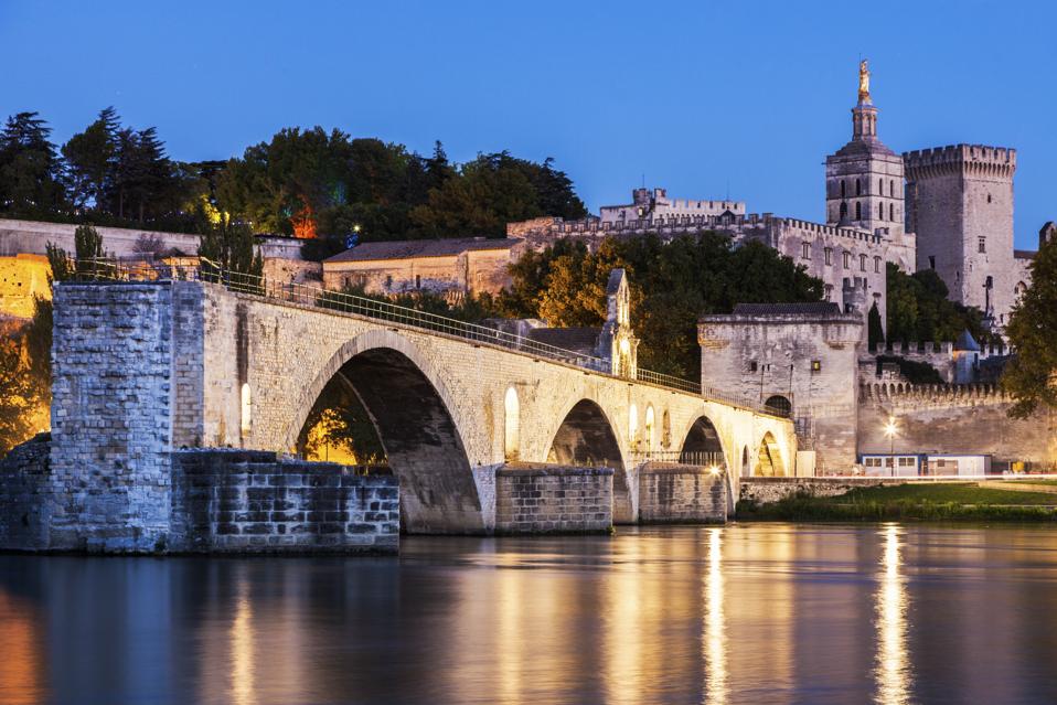 France, Provence-Alpes-Cote dAzur, Avignon, Pont Saint-Benezet on Rhone River and Avignon Cathedral at dusk
