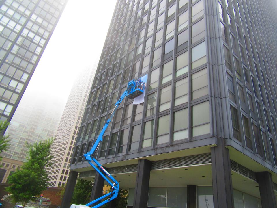 Collage installation over the windows of Esplanade apartments.
