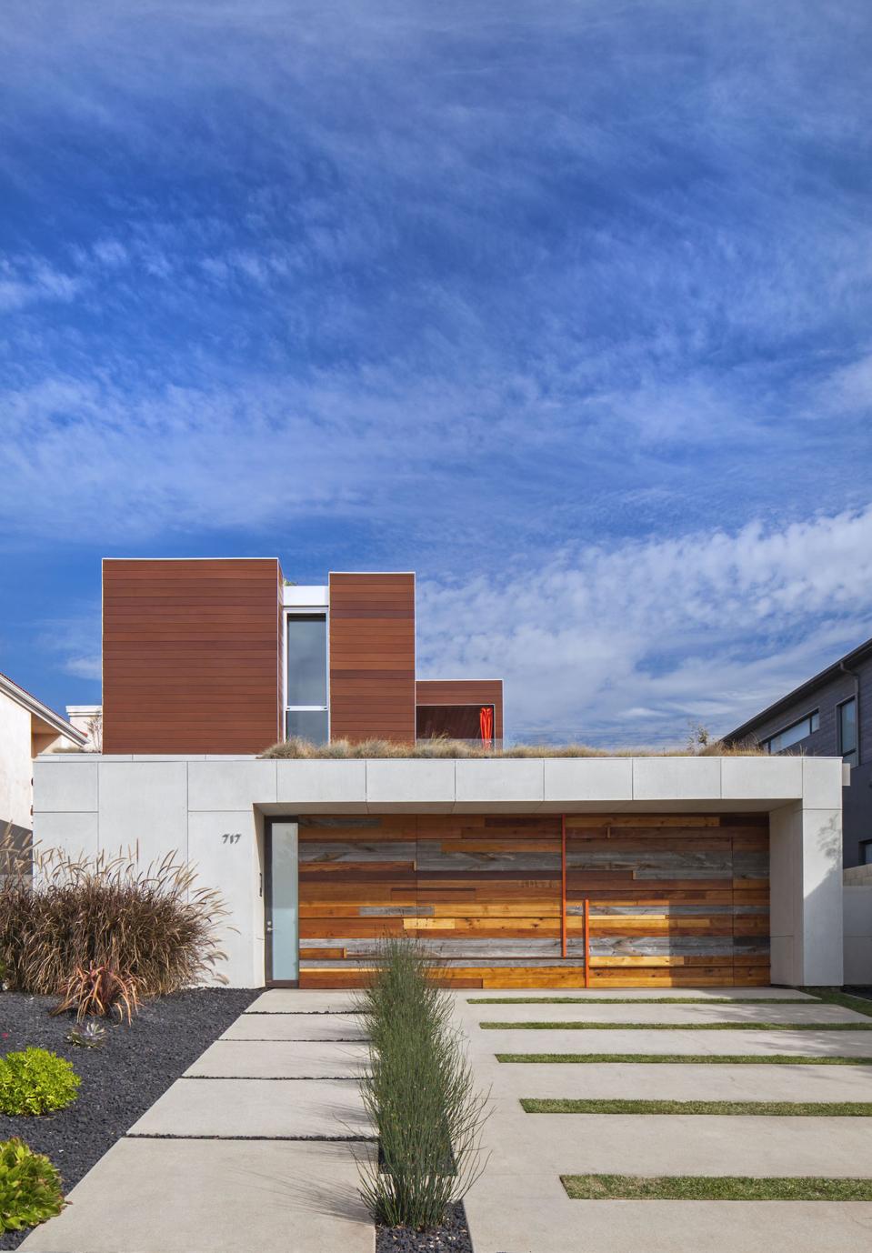 Using scrap wood and quartz, Minarc Architects designed a garage door that is a beautiful art piece and focal point of this Santa Monica house.