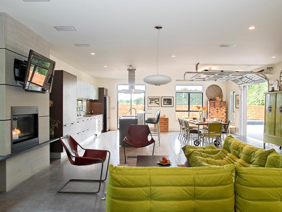 Wheels on the dining table allow the family to use it as a dining table in the house, as well as a picnic table outside when the garage overhead door is opened.