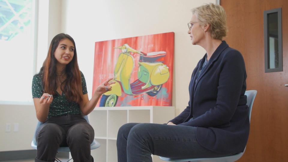 Celebrity Fitness: Celebrity Fitness: Jane Lynch sits with a YMCA youth