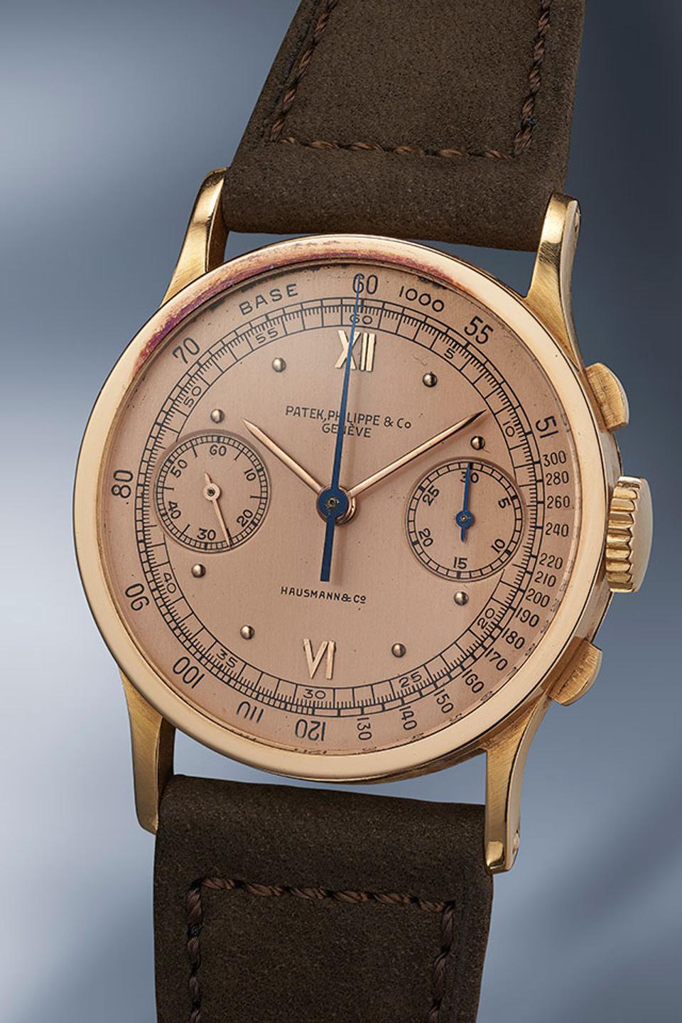 The only publicly known pink gold Patek Philippe chronograph reference 533 with a pink dial that is signed by Italian retailer Hausmann.