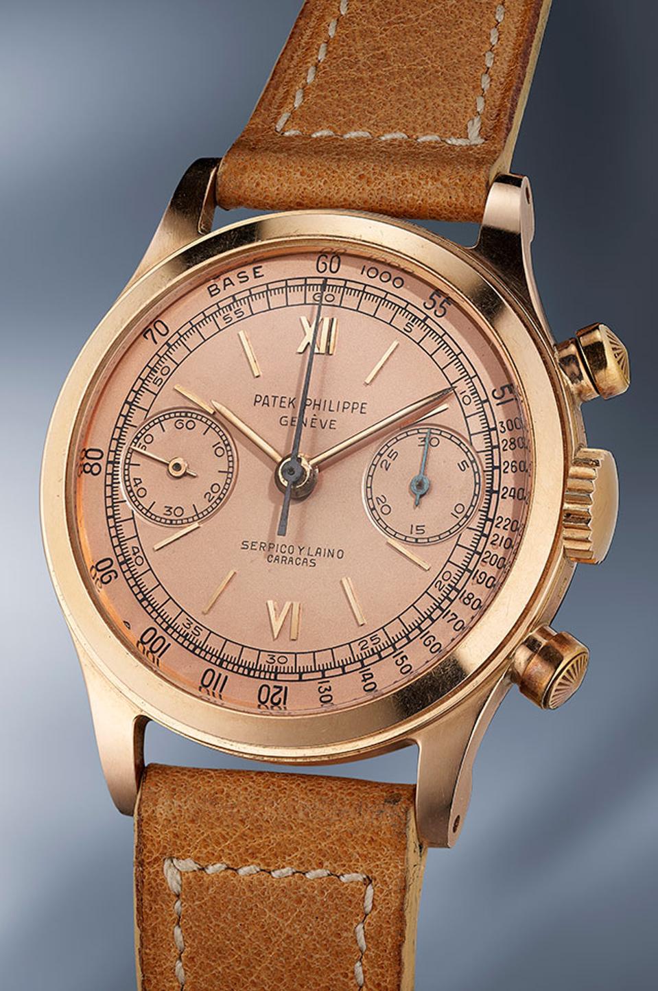 A rare pink gold Patek Philippe chronograph Reference 1463 with pink dial made in 1952 and retailed by Serpico y Laino.