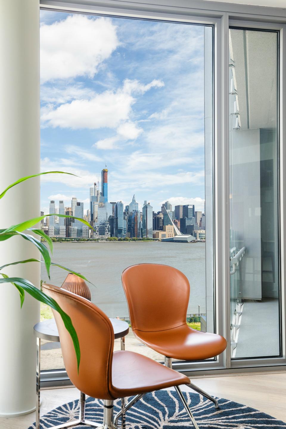 A view of the NYC skyline on the Hudson from an apartment window.
