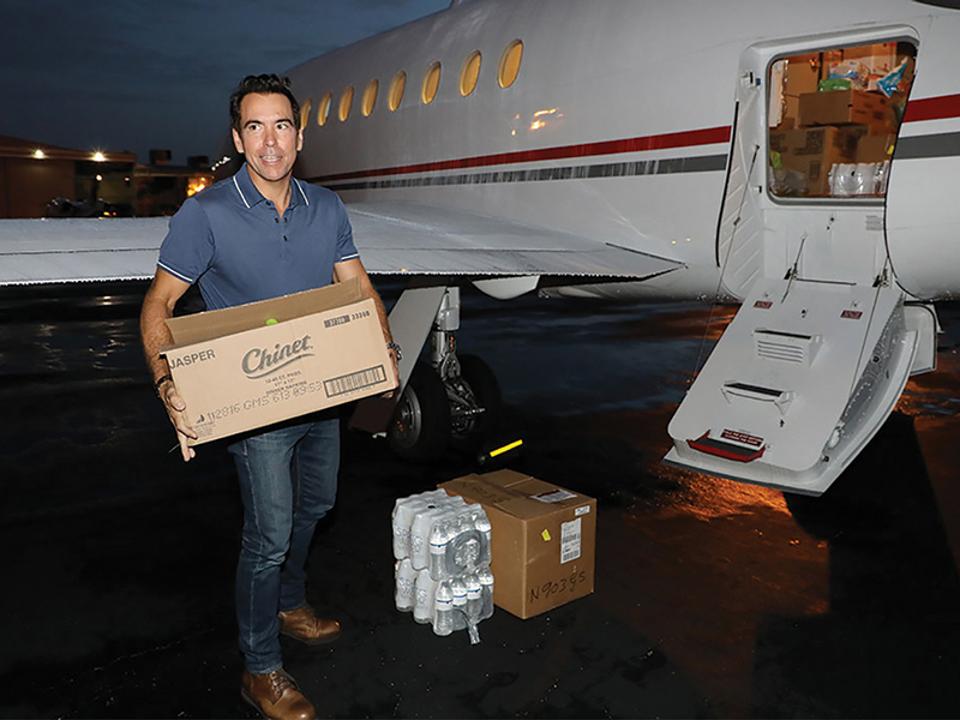 Mission Driven: Days after Hurricane Maria hit his native Puerto Rico, Orlando Bravo loads up a plane in Ft. Lauderdale with hundreds of pounds of supplies, including hydration pills, IV tubes and diapers.