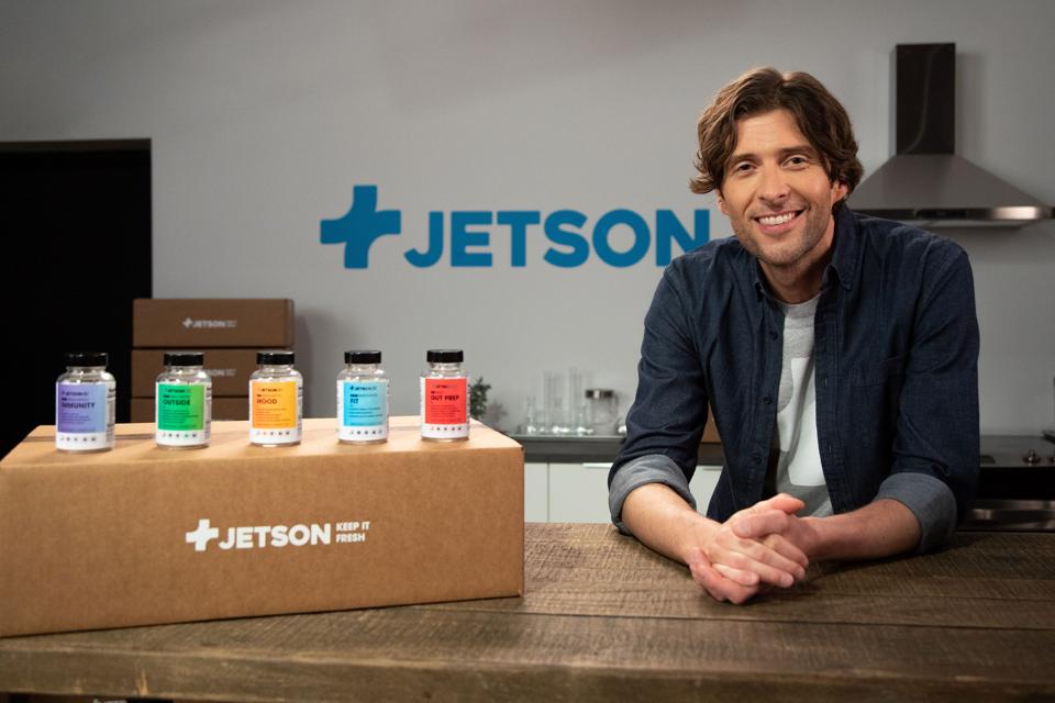 Weitz sits next to a box displaying Jetson probiotics.