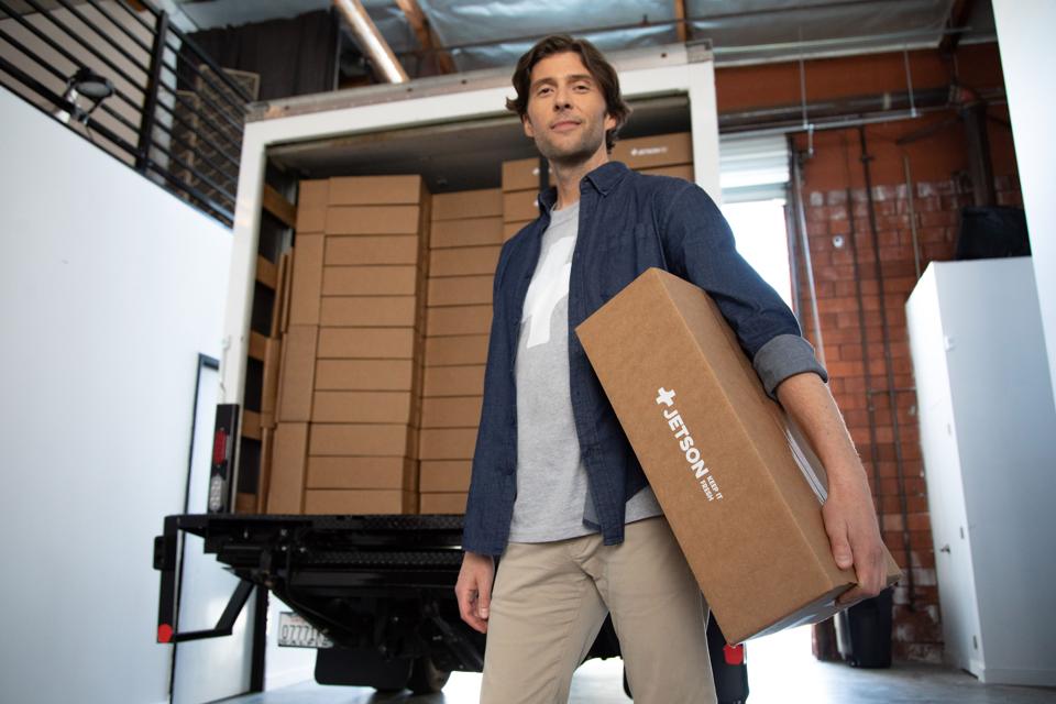 Weitz poses with a box of Jetson products.