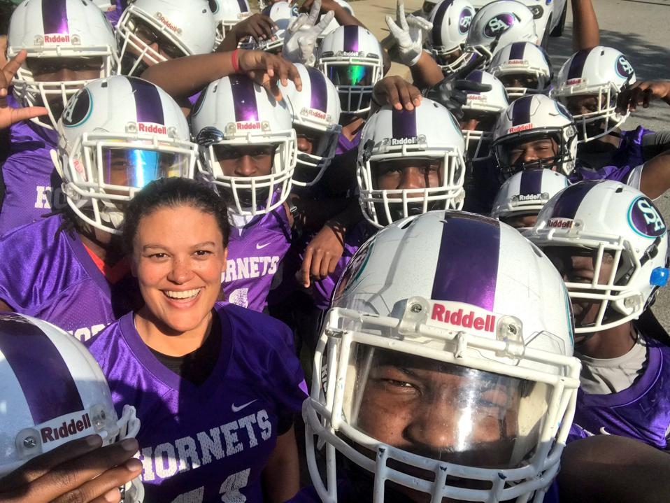 Dr. Carstarphen with football team