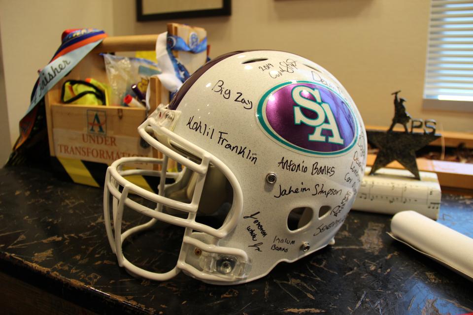 Dr. Carstarphen proudly displays a signed team helmet on her desk
