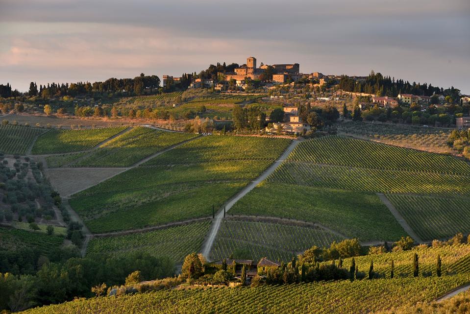 The village of Panzano in Chianti sits on a hilltop amid the hills of vines at the heart of Tuscany