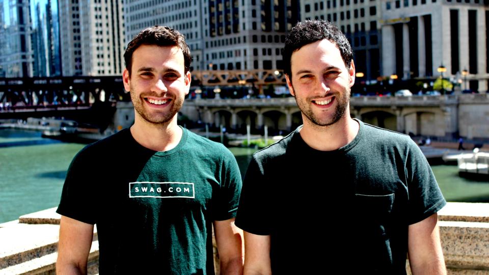 A photograph of Swag.com founders Josh Orbach and Jeremy Parker standing in New York City.
