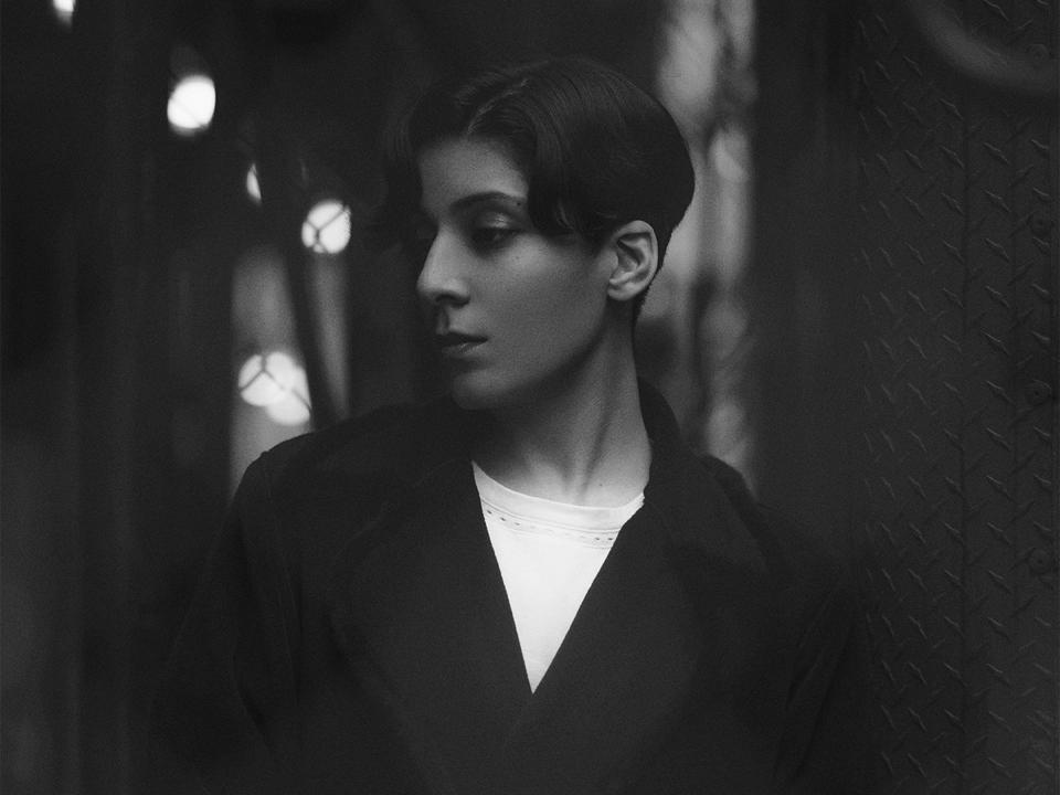 Black and white headshot of Qadiri.