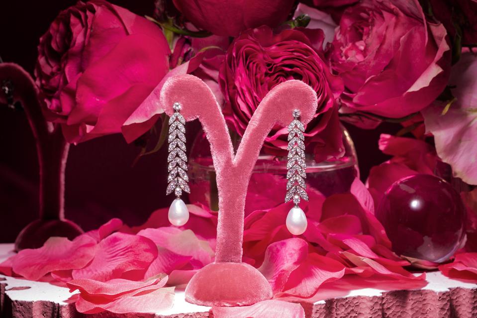 Graceful diamond and baroque pearl earrings by Margaret Jewels glow with gems of earth and sea.