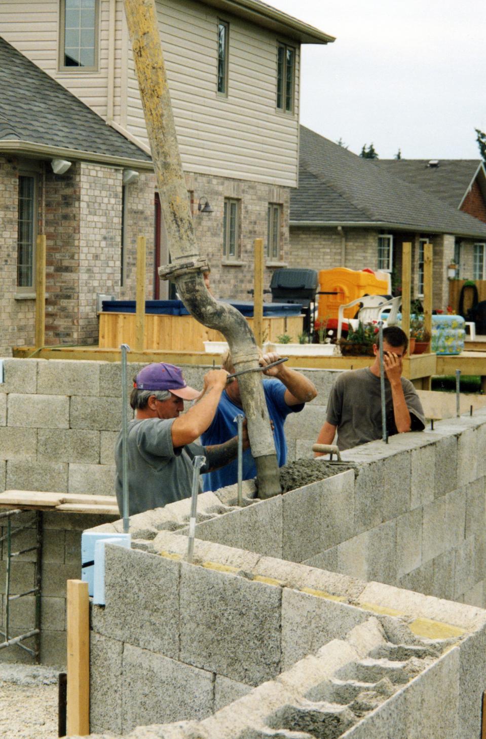 After the blocks are installed, concrete is poured into the installation.