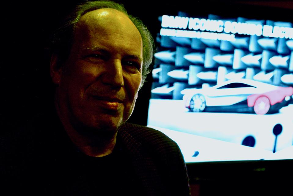 Hans Zimmer with background TV image of BMW car