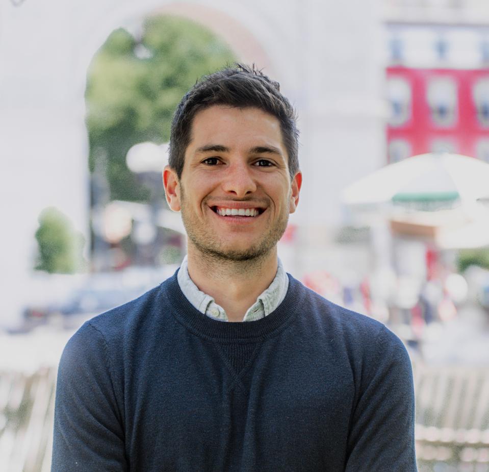 John Meadows, Co-CEO, Bowery Valuation, posing in NYC's Washington Square Park