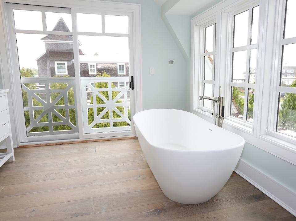 Unlike most solid wood, this engineered wood is durable in a bathroom. 