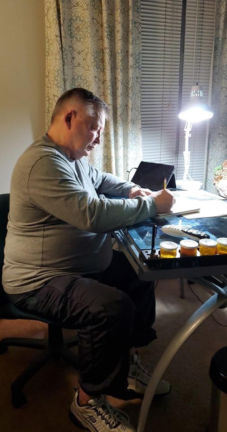 Ronald James draws his own Christmas cards.