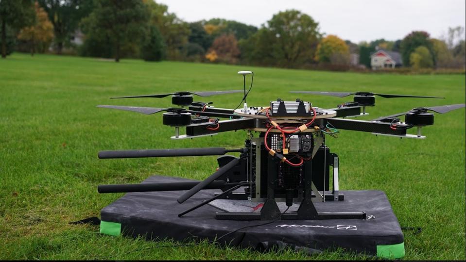Spooky Action's TeleLift ″flying cell phone tower″ tethered drone on the ground before testing in Minnesota.