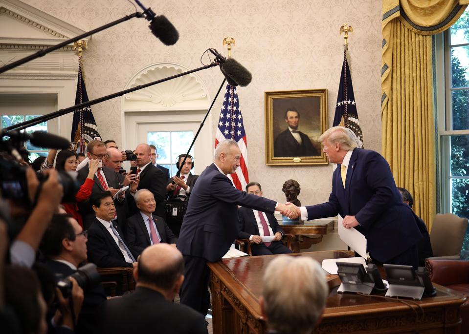 Donald Trump shakes hands with Liu He.
