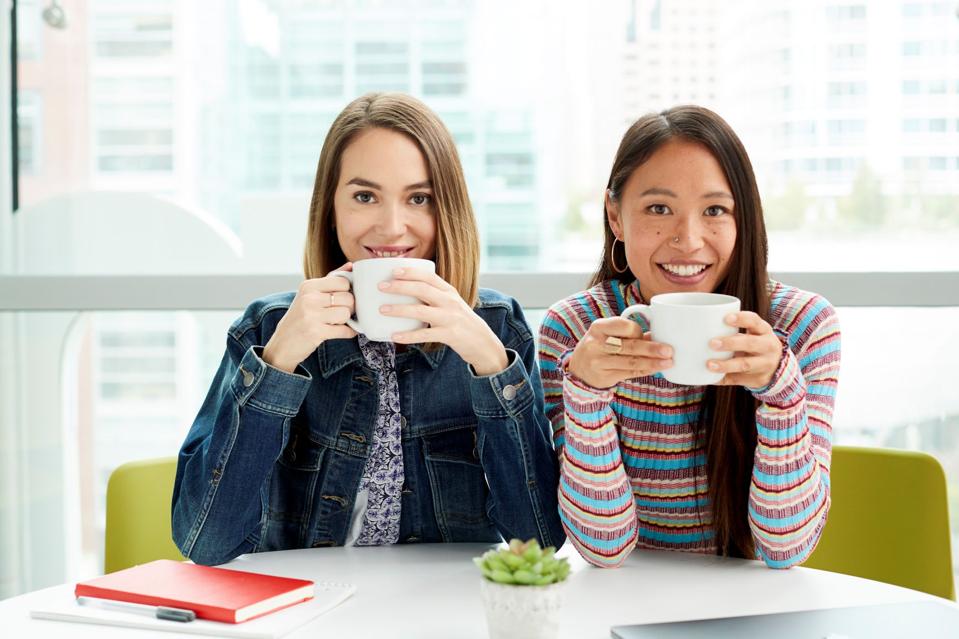 women holding coffee